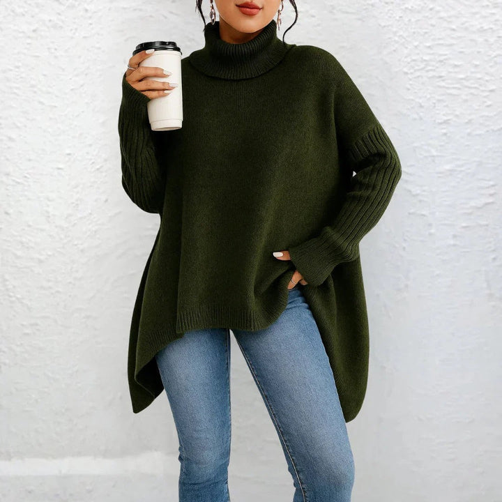 Dunkelgrüner Rollkragenpullover mit weiten Ärmeln und ausgestelltem Saum