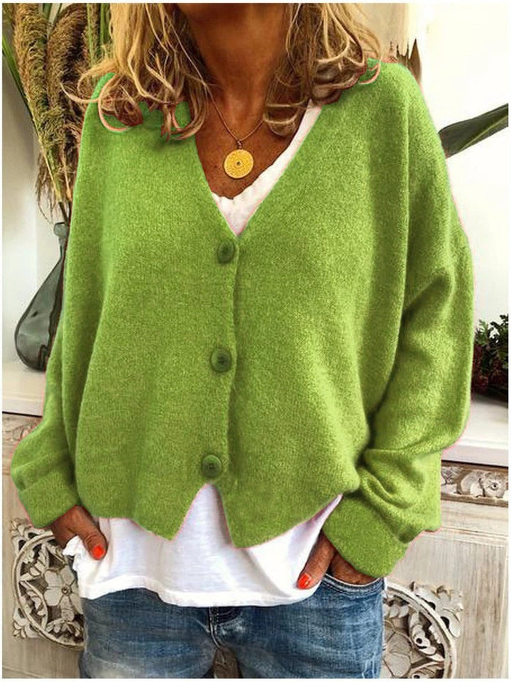 Grüne Strickjacke mit V-Ausschnitt, Knopfleiste und geschwungenem Saum