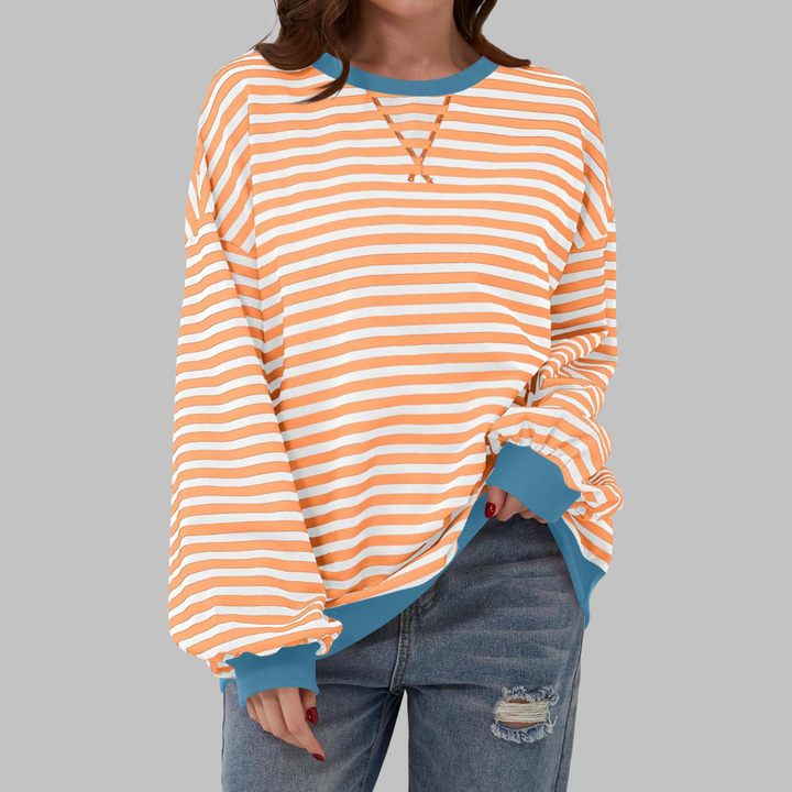 Orange-weiß gestreiftes Sweatshirt mit petrolfarbenen Bündchen und Seitenschlitzen
