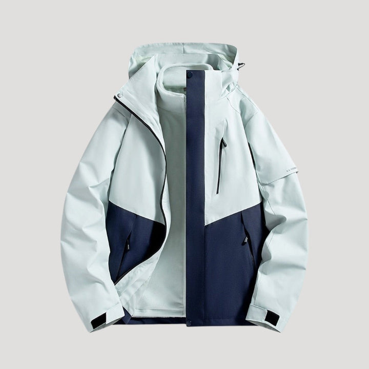 Regenjacke in Mintgrün und Marineblau mit wasserdichten Reißverschlusstaschen