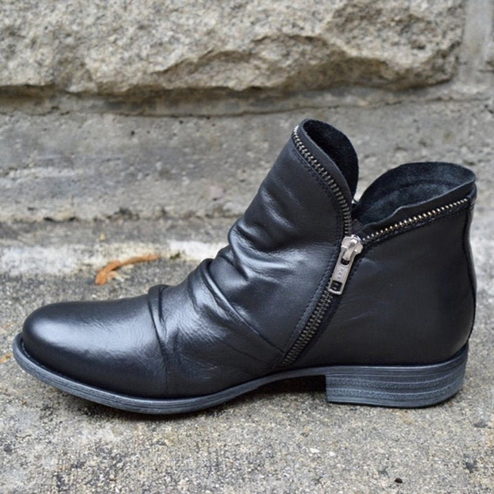 Schwarze Stiefelette aus veganem Leder mit Blockabsatz und Zierreißverschluss