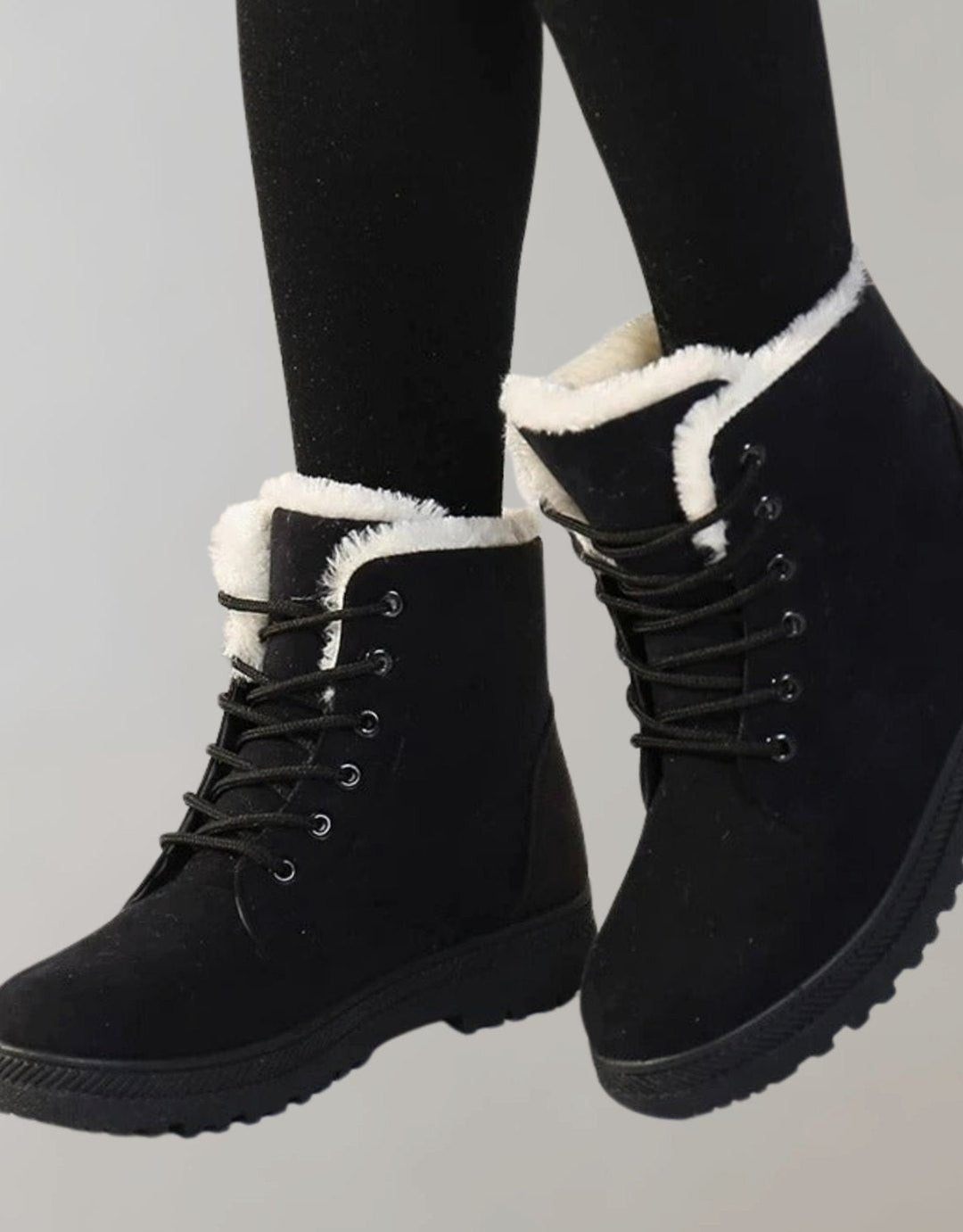 Schwarze Winterstiefeletten mit kuscheligem Fellfutter und robuster Profilsohle