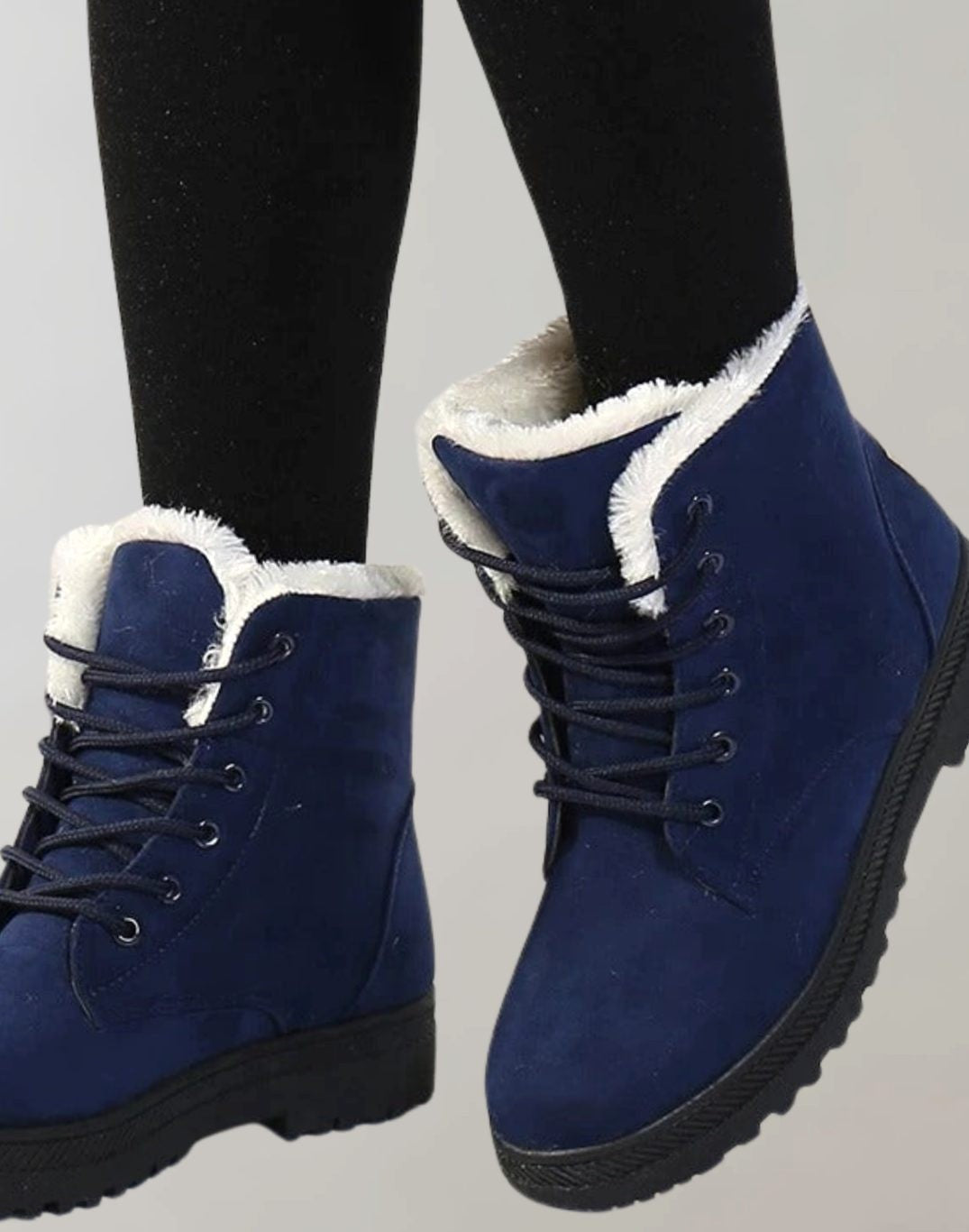 Dunkelblaue Stiefeletten mit weißem Fellfutter und praktischer Schnürung