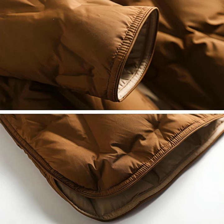 Ärmelbündchen und Saum der braunen Steppjacke im Detail