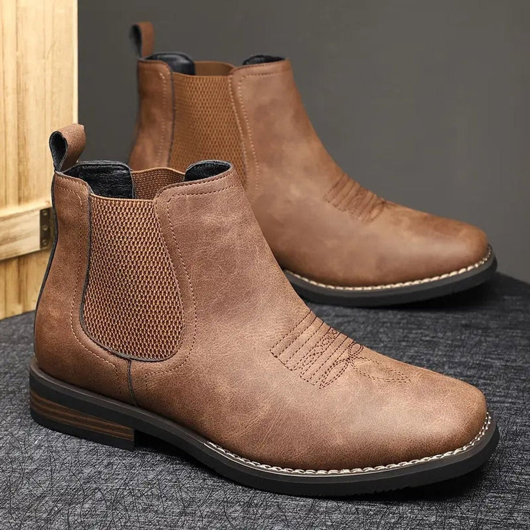 Braune Chelsea Stiefeletten mit genarbter Lederoptik und Kontrastnaht