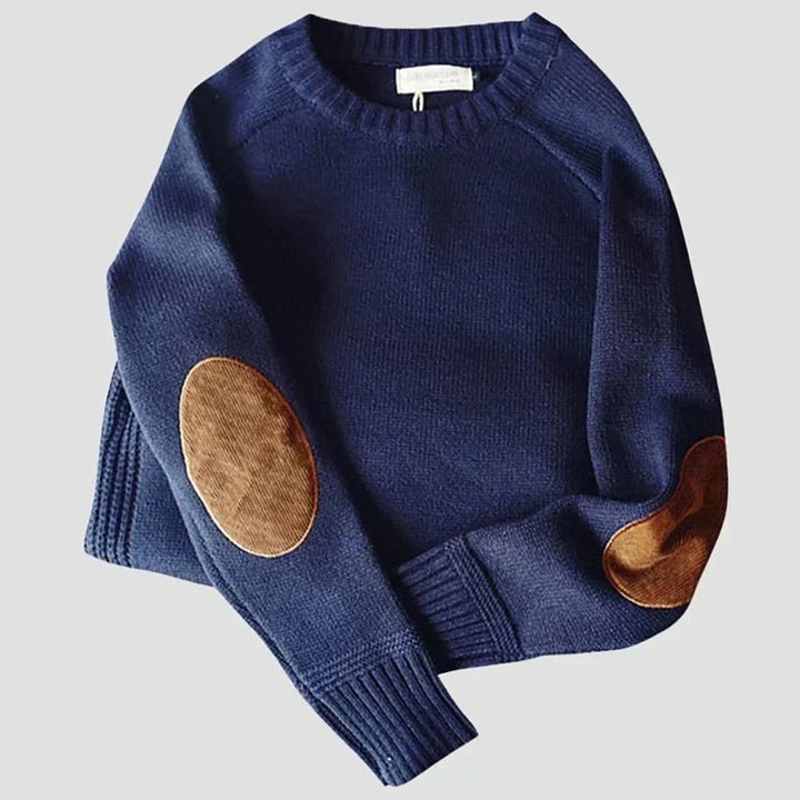 Dunkelblauer Strickpullover mit Rundhalsausschnitt und braunen Ellbogenpatches